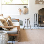Natural beige textured woven rug with subtle crosshatch pattern