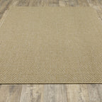 Natural beige textured woven rug with subtle crosshatch pattern