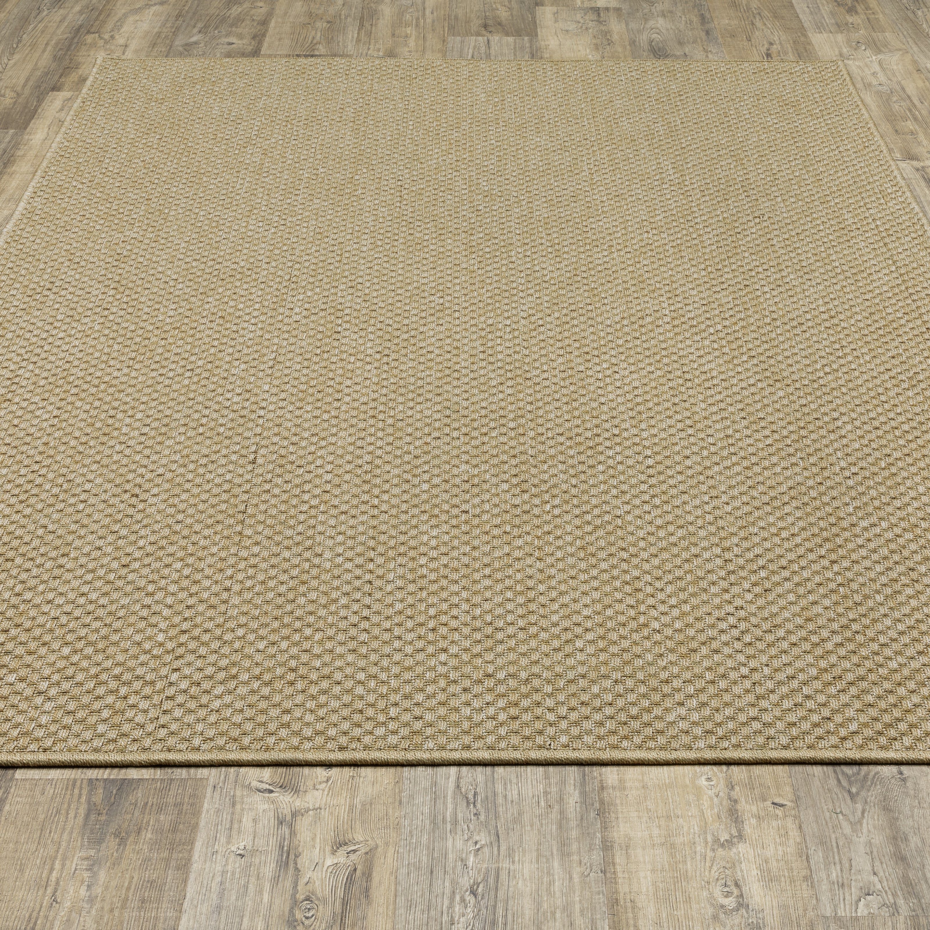 Natural beige textured woven rug with subtle crosshatch pattern