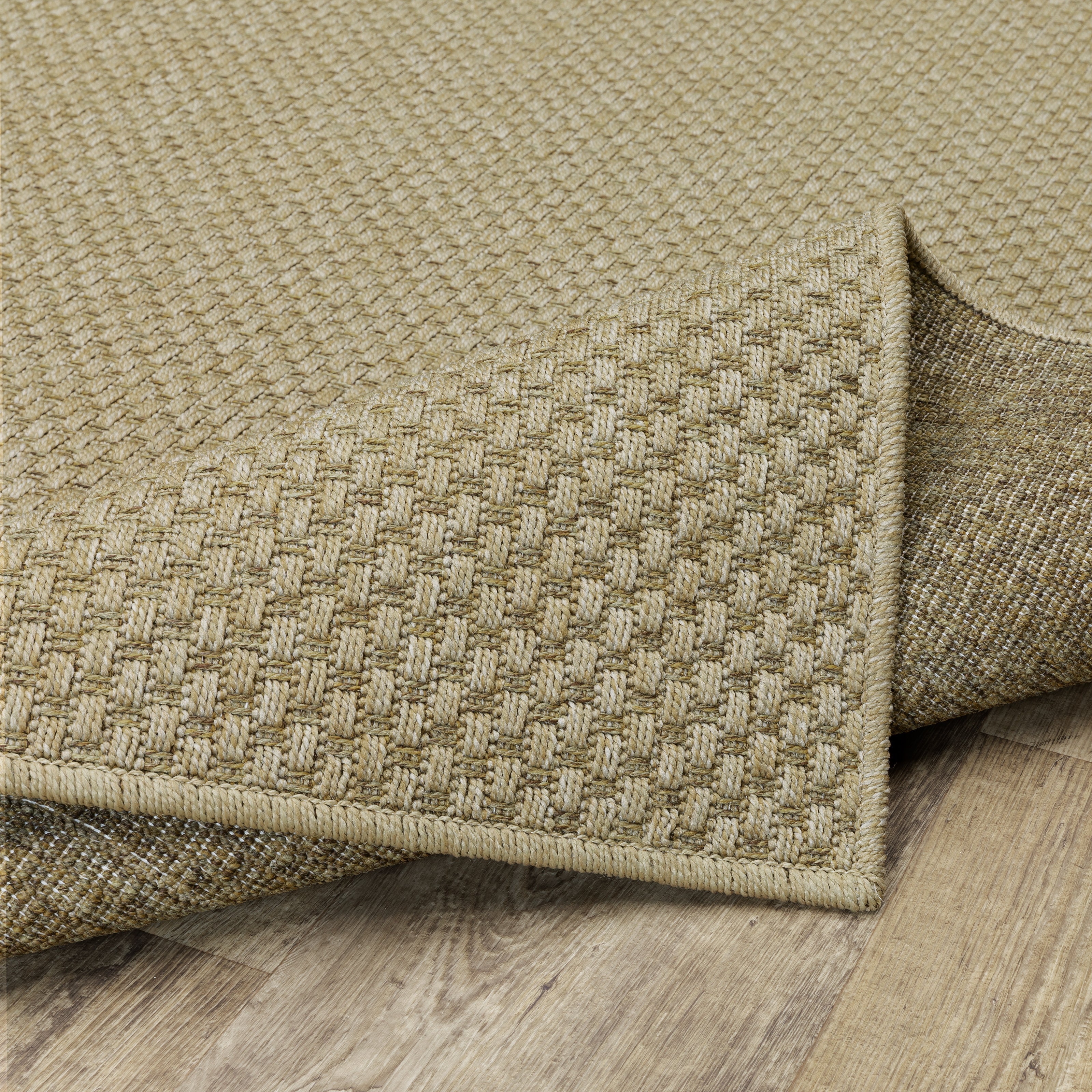 Natural beige textured woven rug with subtle crosshatch pattern