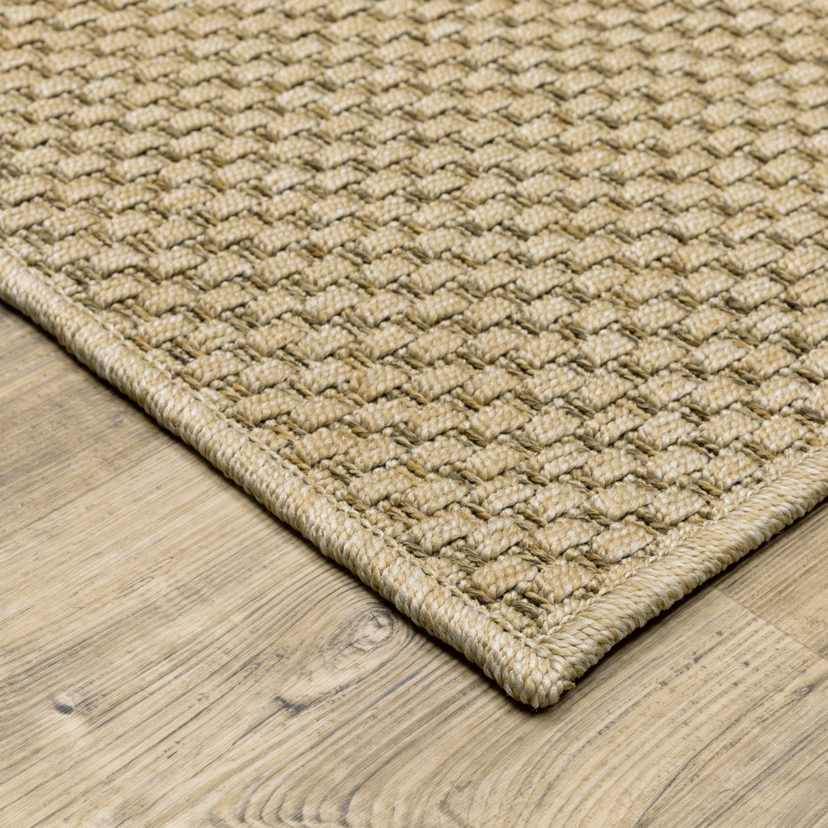 Natural beige textured woven rug with subtle crosshatch pattern