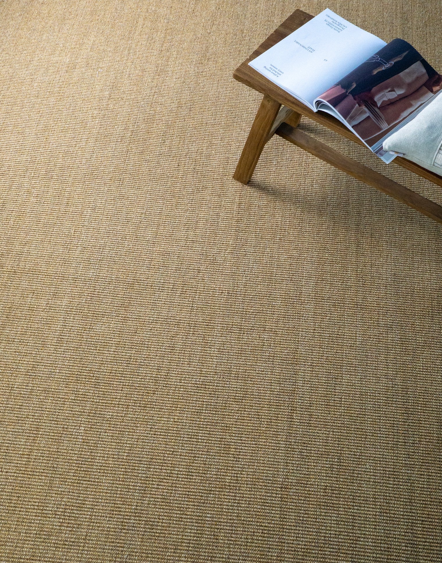 Natural woven jute rug with tight basket weave texture in tan and beige