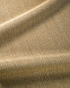 Natural woven jute rug with tight basket weave texture in tan and beige