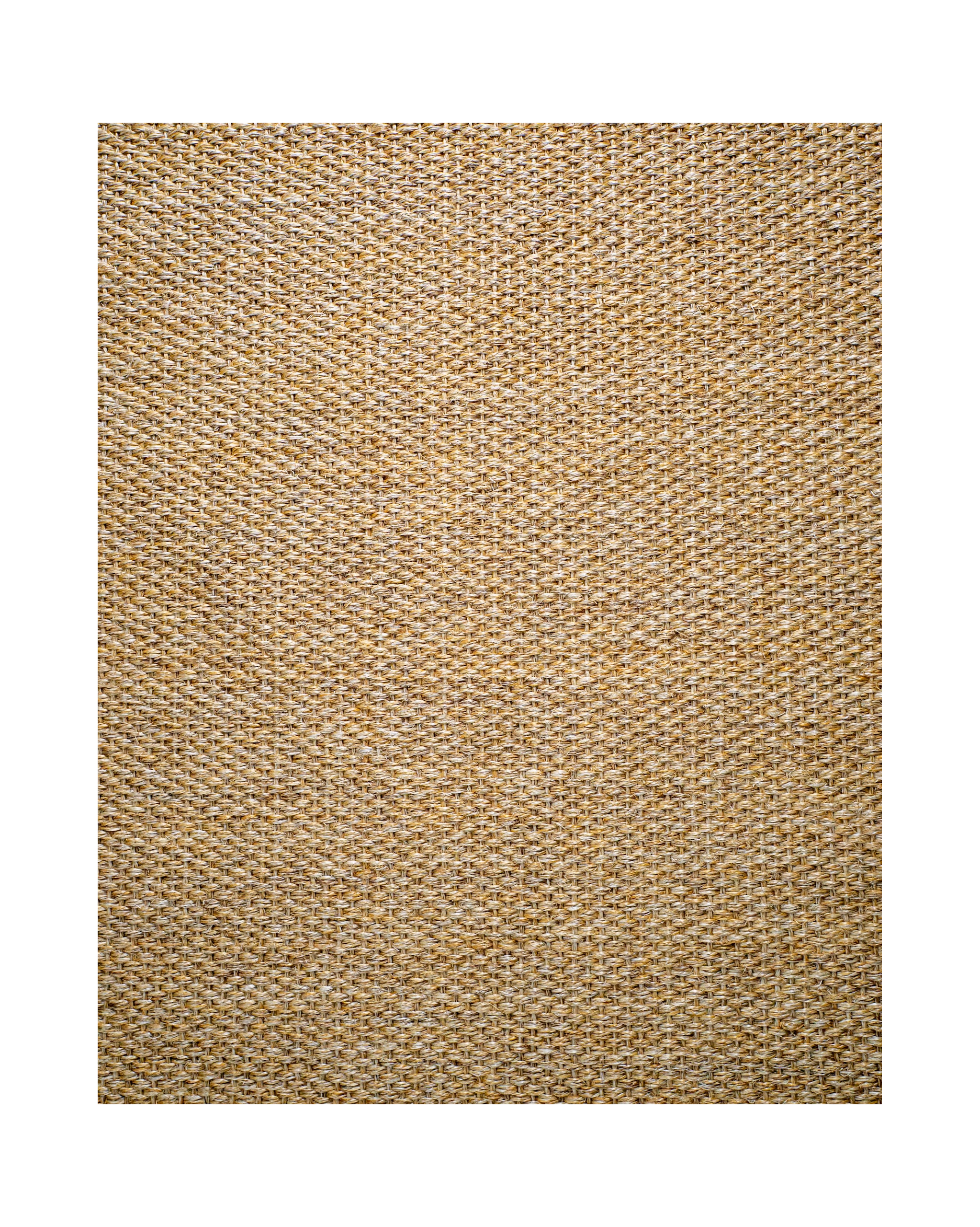 Natural woven jute rug with tight basket weave texture in tan and beige