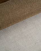 Olive green textured wool rug with tight woven pattern in neutral tone