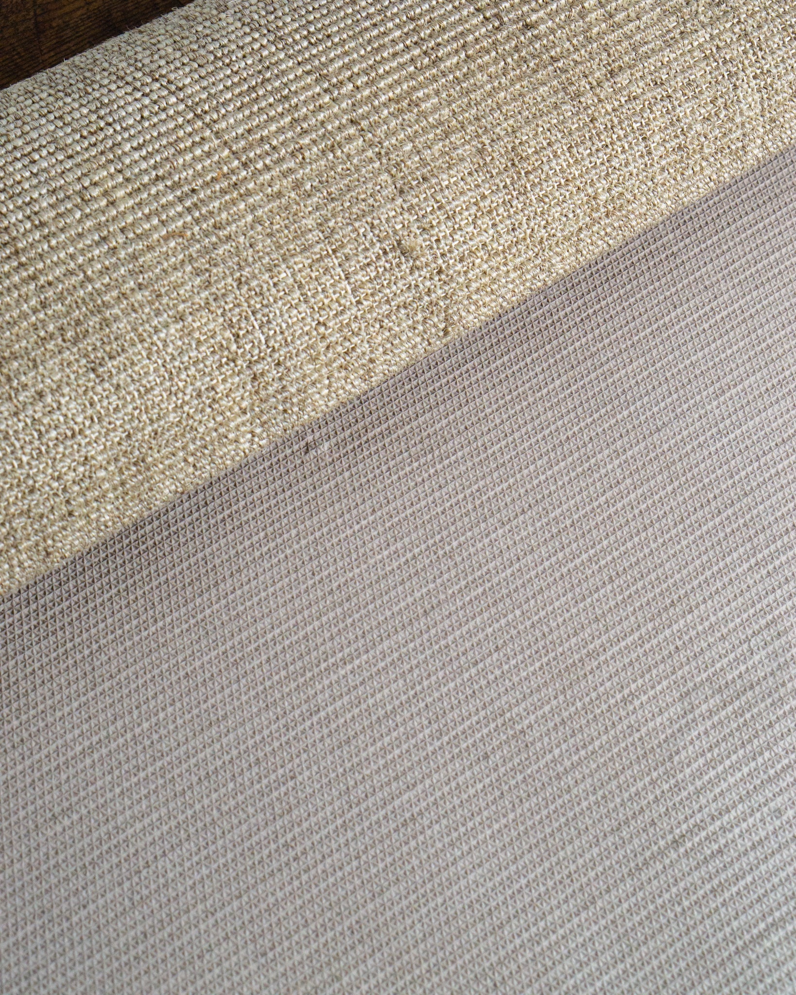 Neutral beige textured woven rug with ribbed pattern in natural fibers