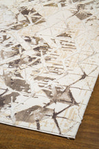 Beige isometric geometric rug with brown abstract pattern and distressed texture