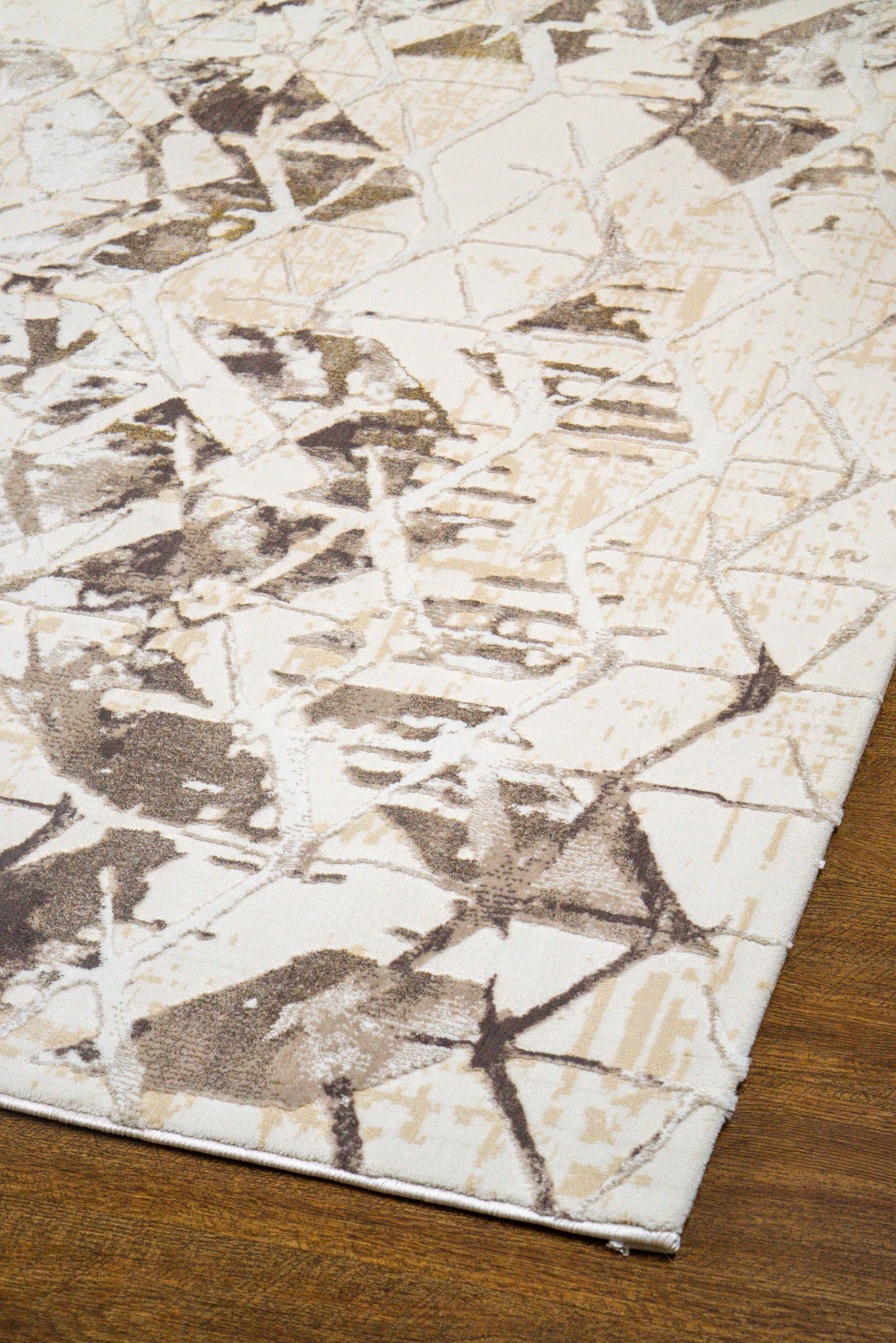 Beige isometric geometric rug with brown abstract pattern and distressed texture