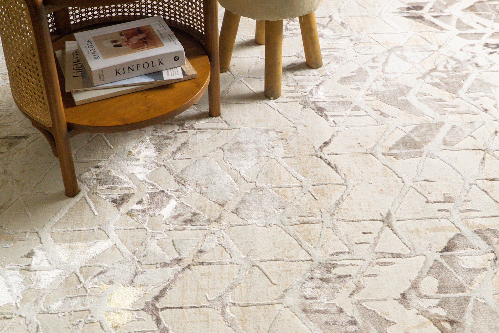 Beige isometric geometric rug with brown abstract pattern and distressed texture