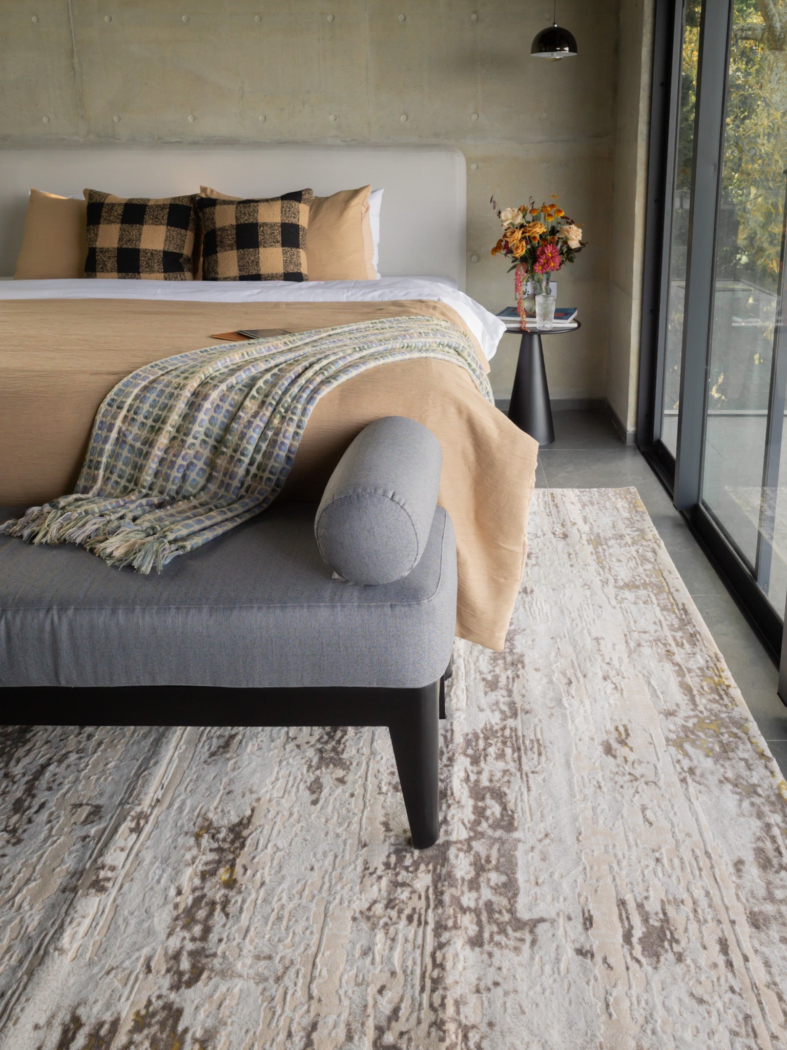 Distressed beige and grey rug with abstract texture and worn vintage aesthetic