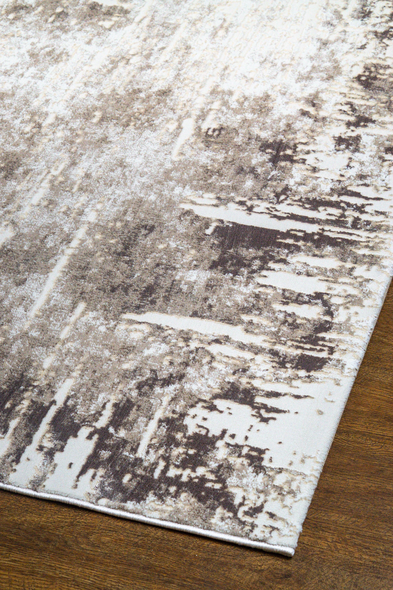 Distressed cream and grey area rug with vintage abstract pattern and worn texture