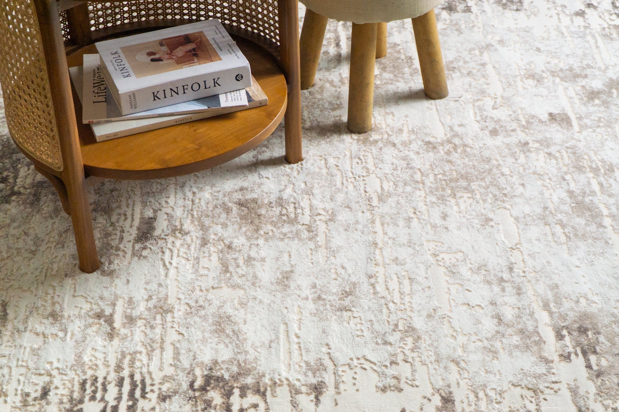 Distressed cream and grey area rug with vintage abstract pattern and worn texture