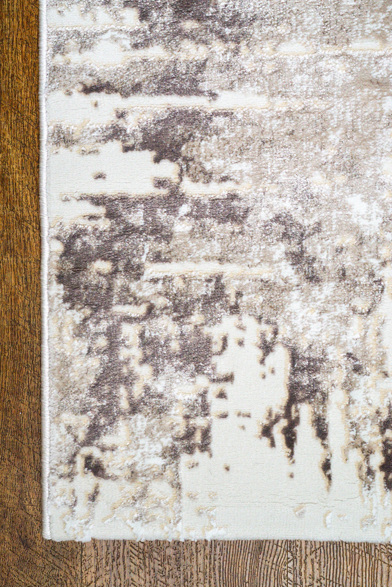 Distressed cream and grey area rug with vintage abstract pattern and worn texture