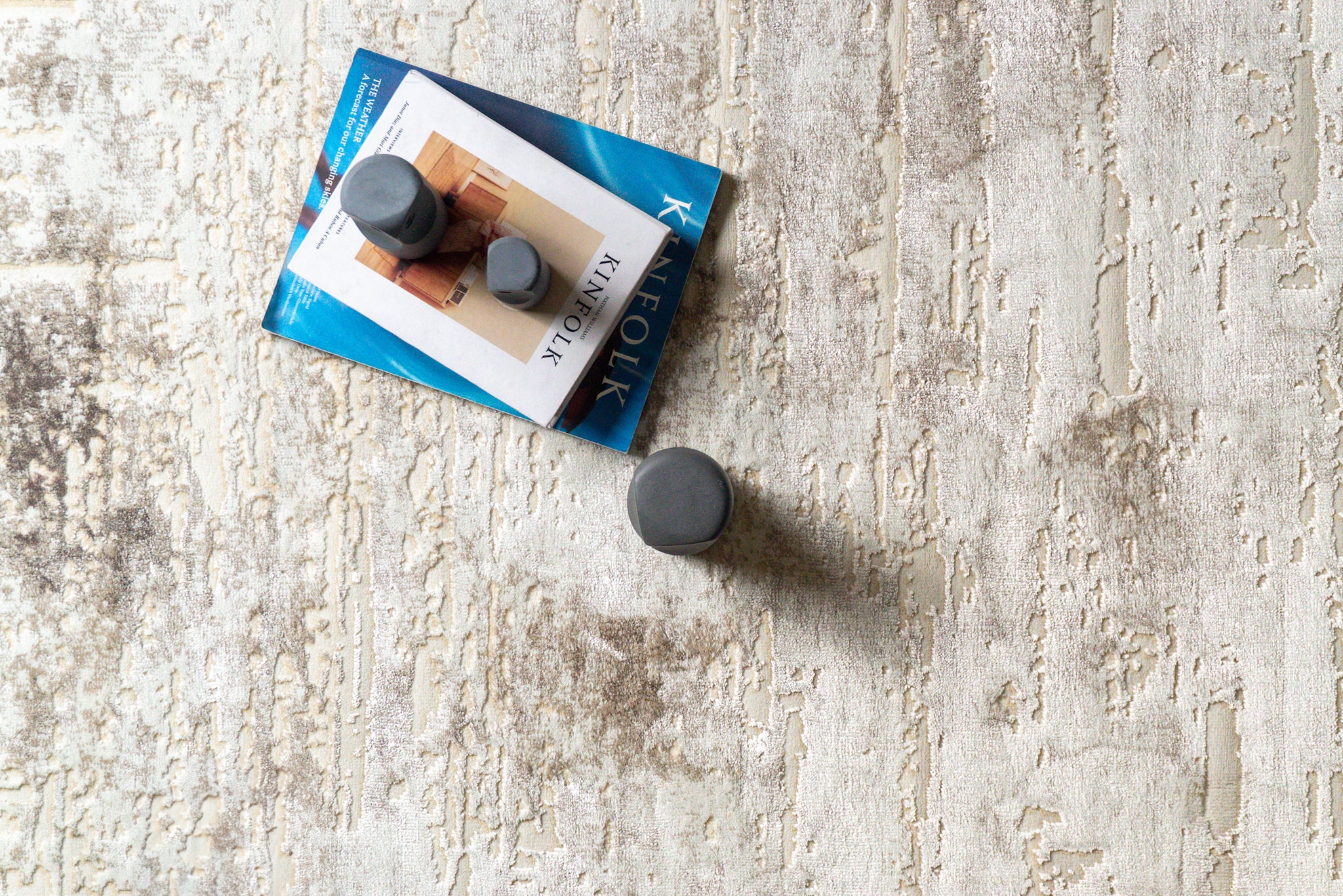 Distressed cream and grey area rug with vintage abstract pattern and worn texture