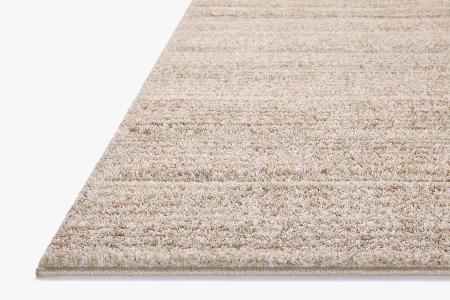 Beige textured area rug with horizontal woven pattern in neutral tones