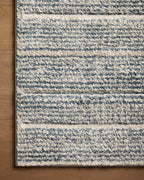 Modern striped area rug in grey, beige and cream tones with textured weave