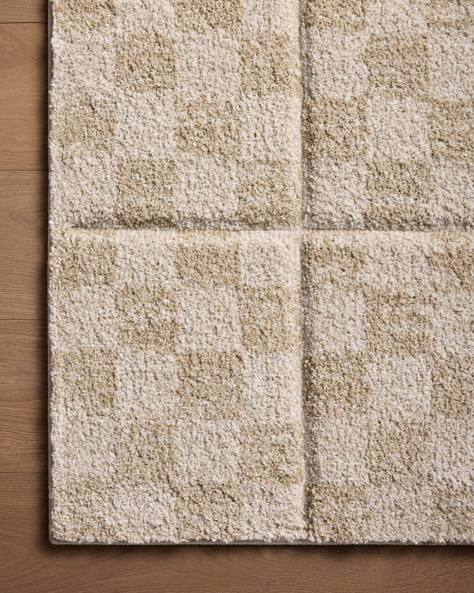 Beige checkered wool rug with textured geometric pattern design