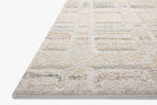 Beige geometric patterned rug with grey accents and textured wool construction