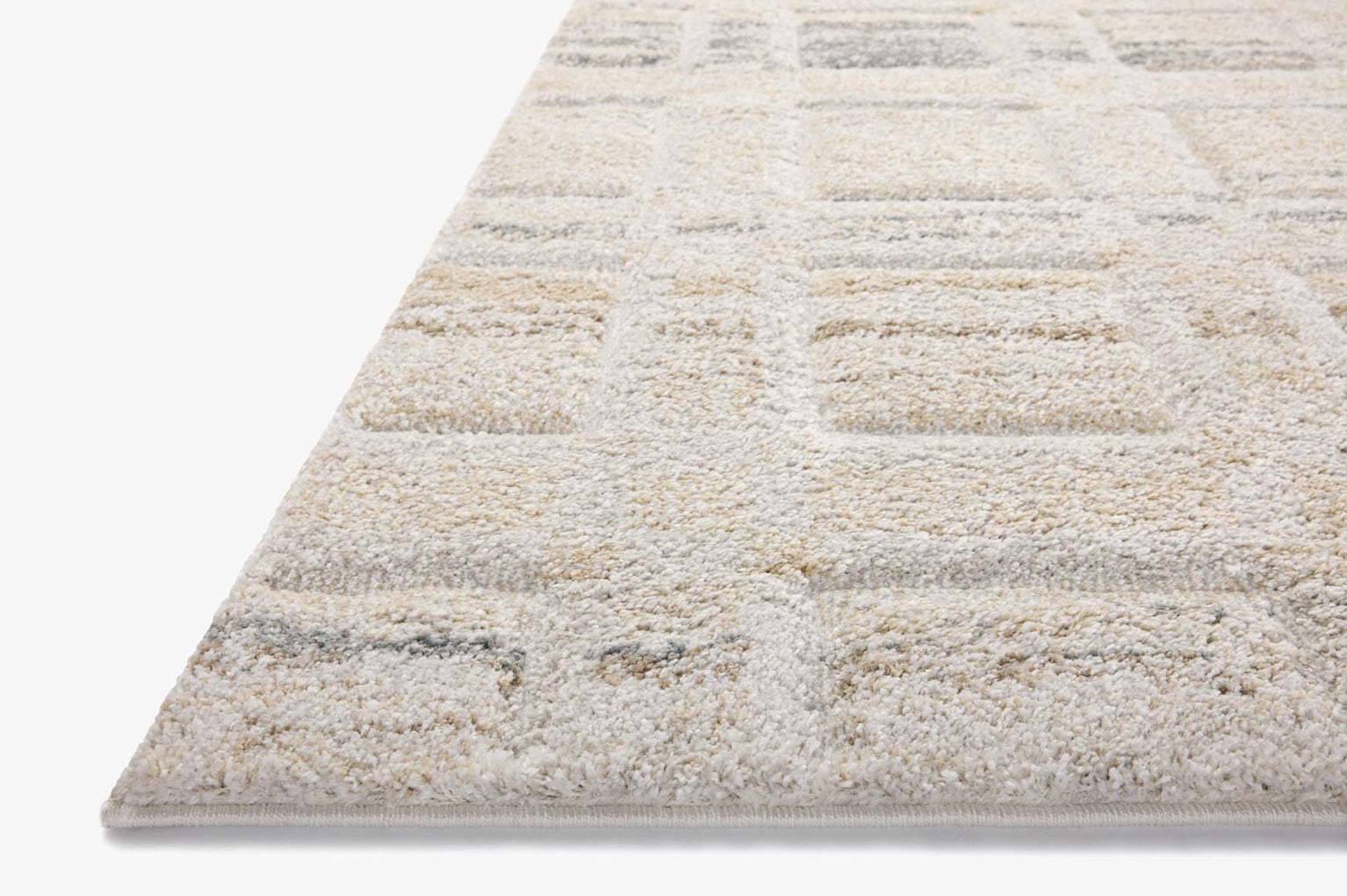 Beige geometric patterned rug with grey accents and textured wool construction