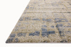 Beige and blue abstract geometric patterned rug with textured wool surface