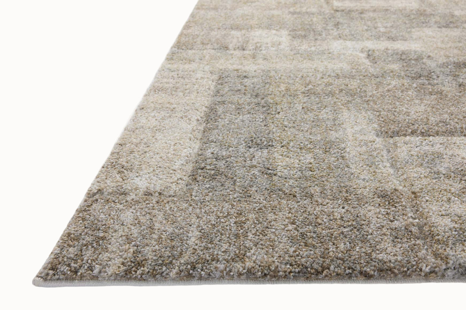 Beige and gray geometric patterned rug with textured woven surface