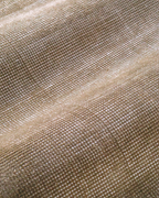 Beige textured rug with subtle horizontal striations and soft woven finish