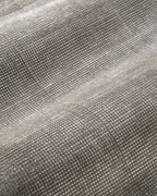 Soft grey velvet rug with subtle texture and neutral tone, rectangular shape