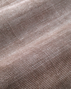 Soft taupe velvet rug with subtle texture and minimalist design