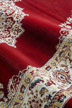 Burgundy traditional rug with ornate gold and cream floral medallion pattern