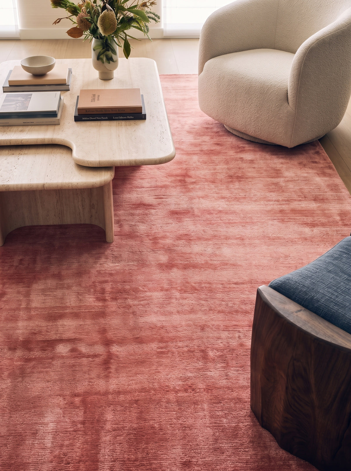 Amara viscose hand-loomed area rug in Coral Pink, lifestyle close-up