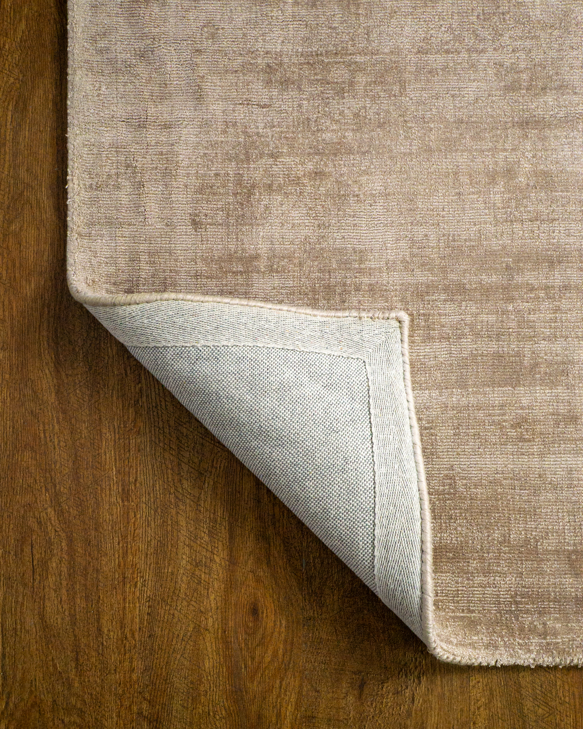 Amara viscose hand-loomed area rug in Dark Brown, backing view