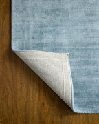 Amara viscose hand-loomed area rug in Dark Cyan, backing view