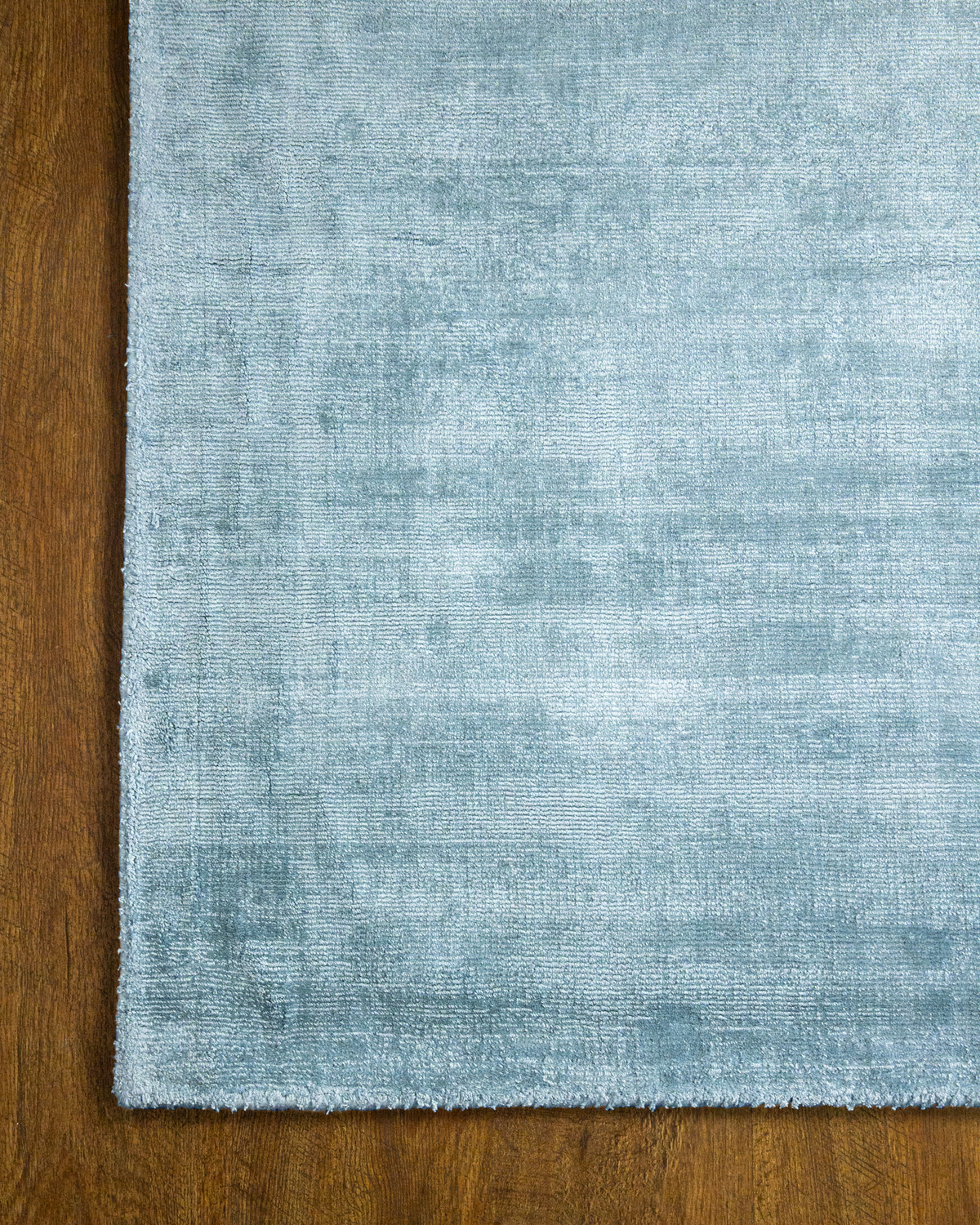 Amara viscose hand-loomed area rug in Dark Cyan, corner detail
