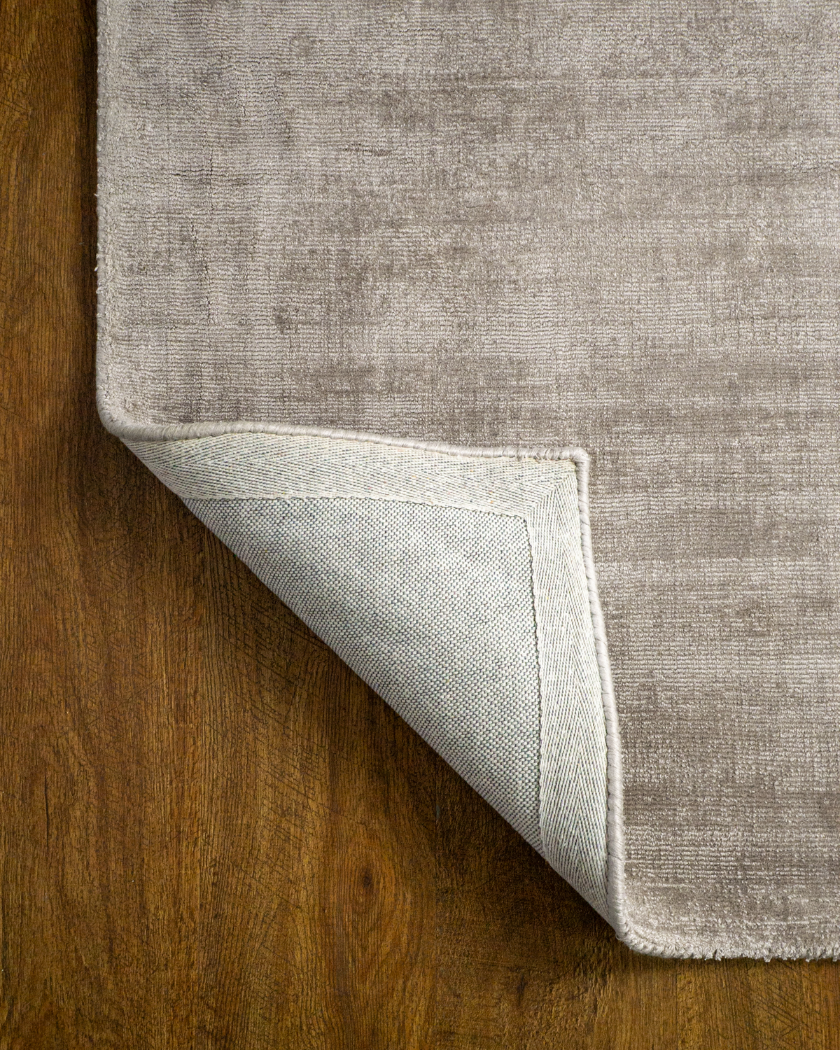 Amara viscose hand-loomed area rug in Dusk Grey, backing view