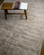 Amara viscose hand-loomed area rug in Dusk Grey, styled in a living room
