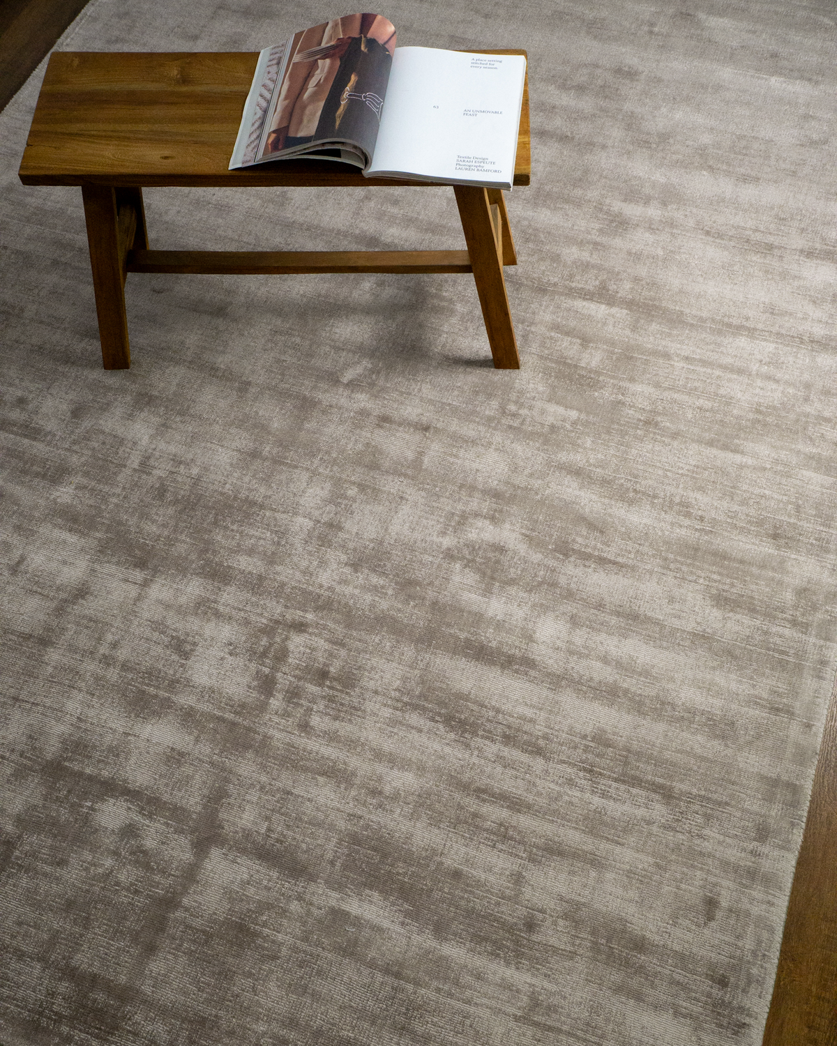 Amara viscose hand-loomed area rug in Dusk Grey, styled in a living room