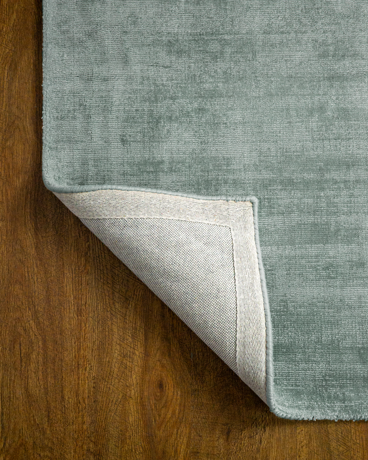 Amara viscose hand-loomed area rug in Evergreen, backing view