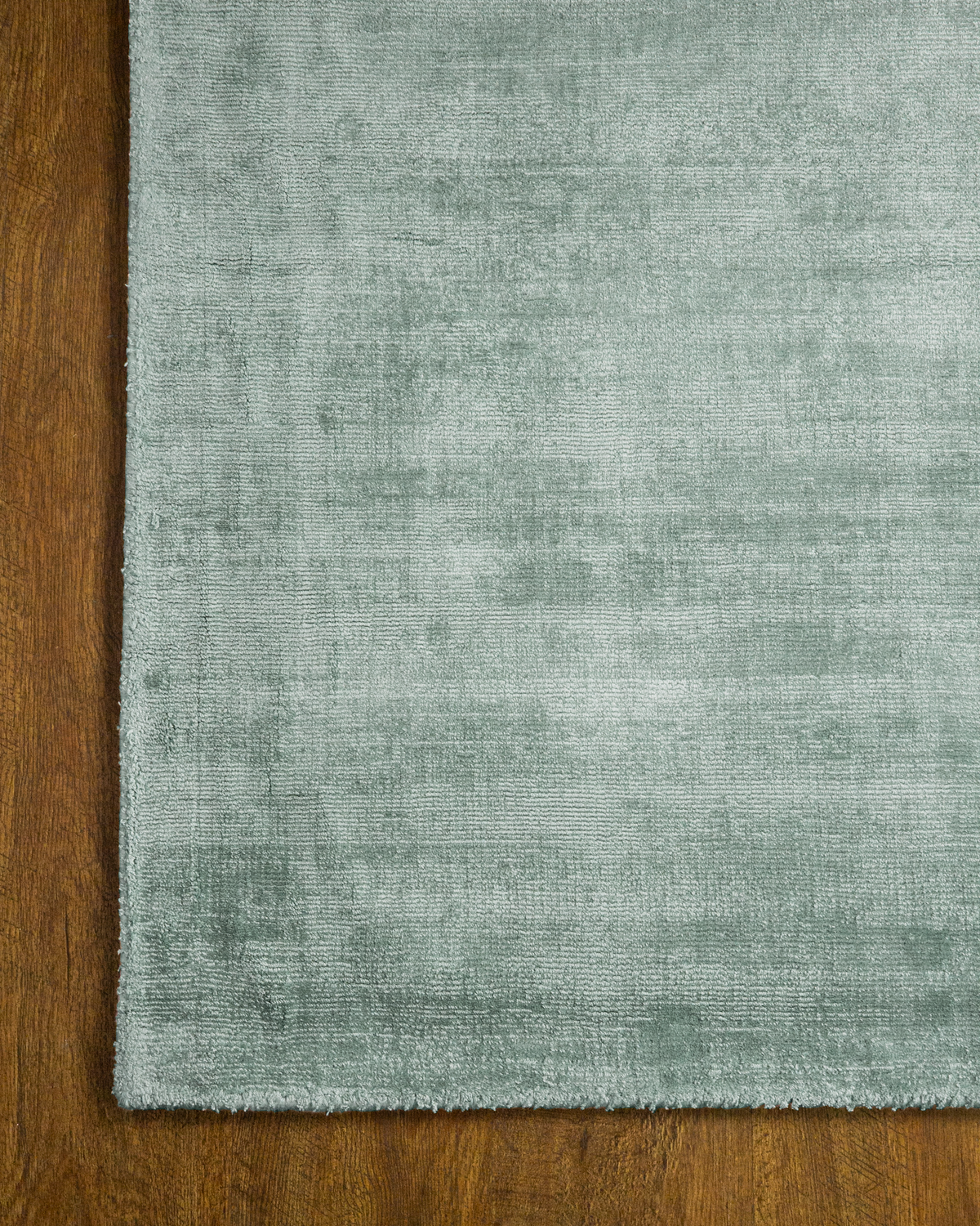 Amara viscose hand-loomed area rug in Evergreen, corner detail