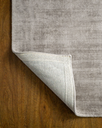Amara viscose hand-loomed area rug in Light Grey, backing view
