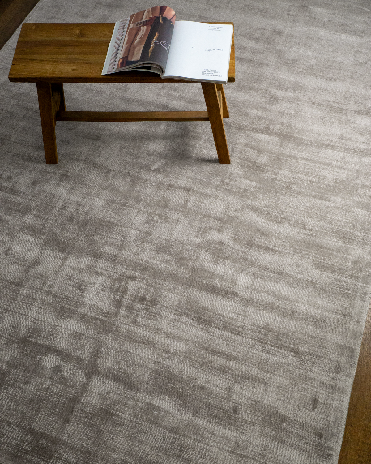 Amara viscose hand-loomed area rug in Light Grey, styled in a living room