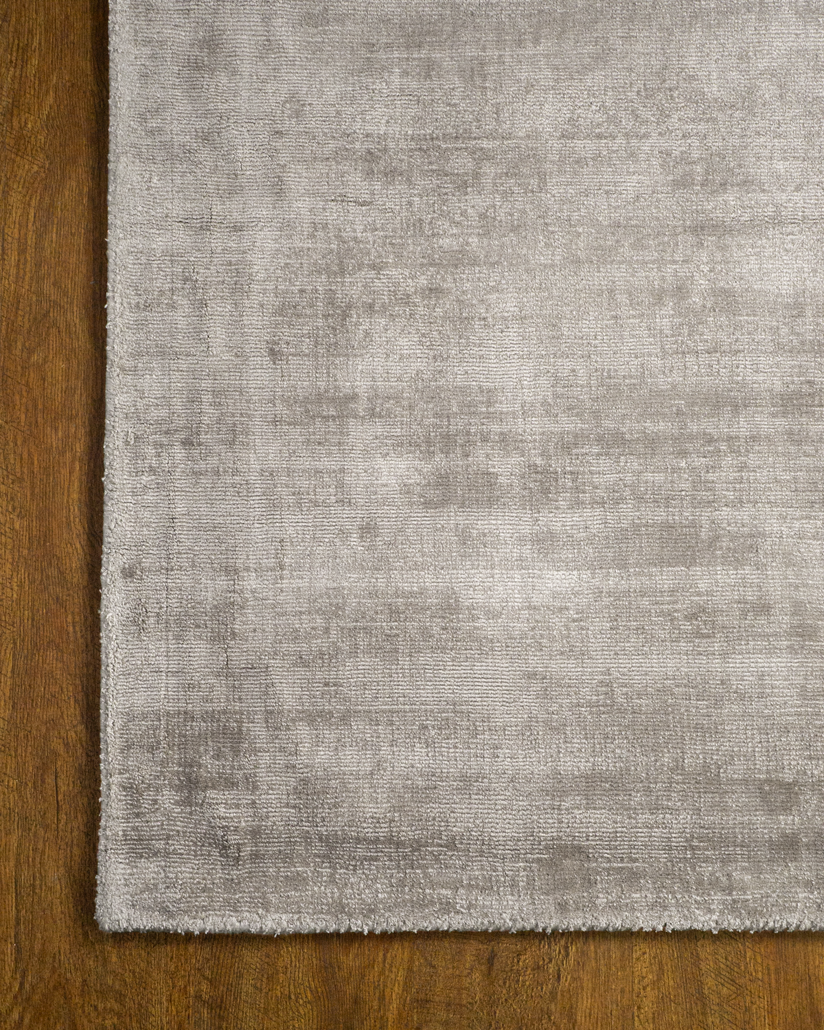 Amara viscose hand-loomed area rug in Light Grey, corner detail