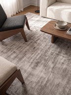 Amara viscose hand-loomed area rug in Light Grey, lifestyle close-up