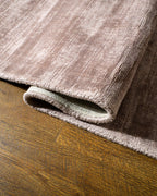 Amara viscose hand-loomed area rug in Light Mauve, curled edge detail