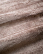 Amara viscose hand-loomed area rug in Light Mauve, draped to show the sheen