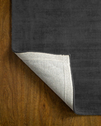 Amara viscose hand-loomed area rug in Navy Black, backing view