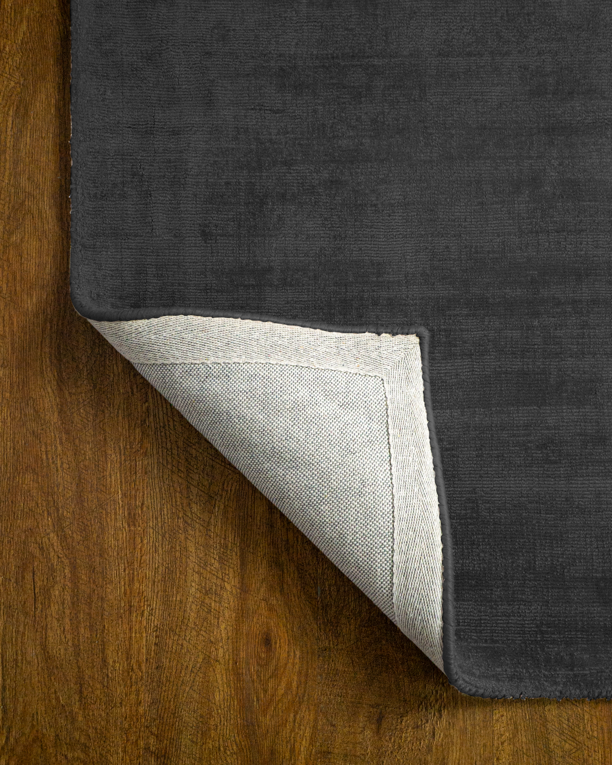 Amara viscose hand-loomed area rug in Navy Black, backing view