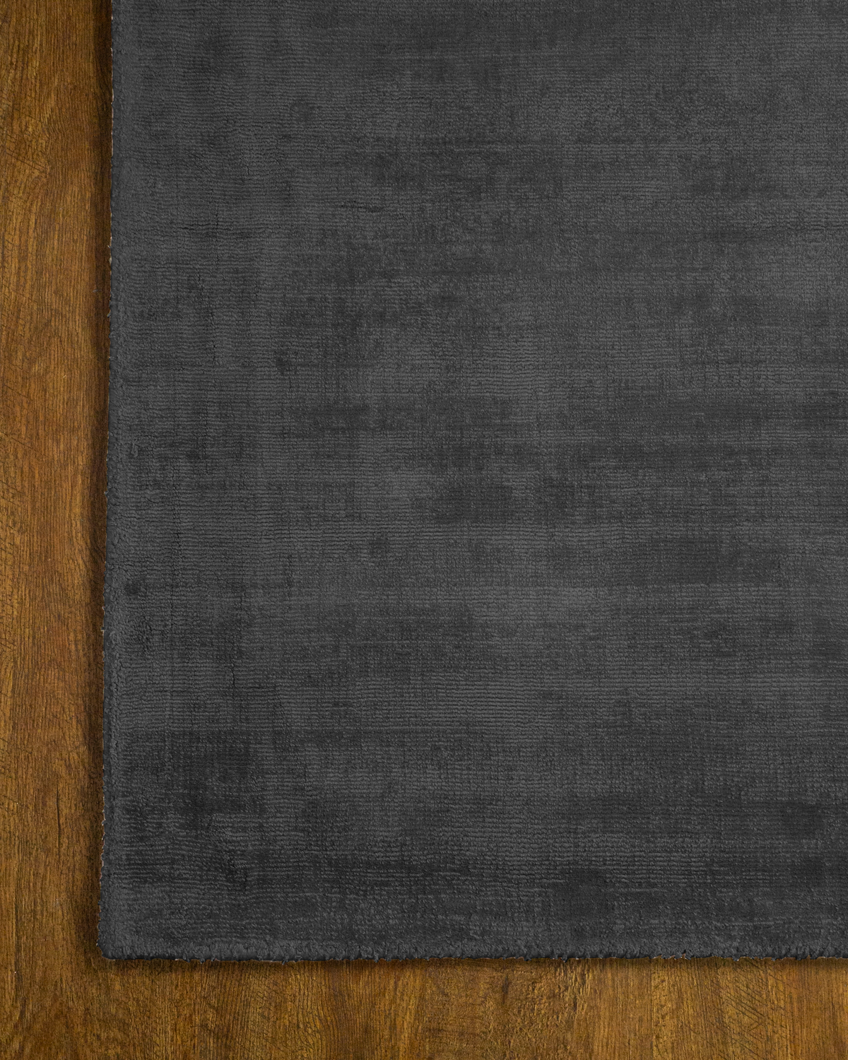 Amara viscose hand-loomed area rug in Navy Black, corner detail