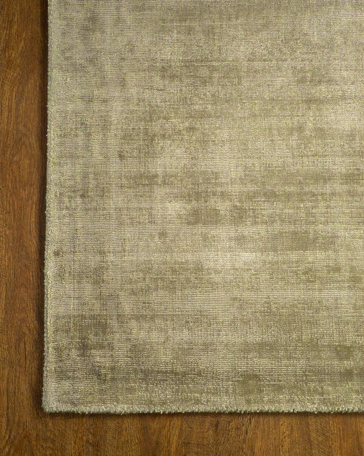 Amara viscose hand-loomed area rug in Olive Brown, corner detail