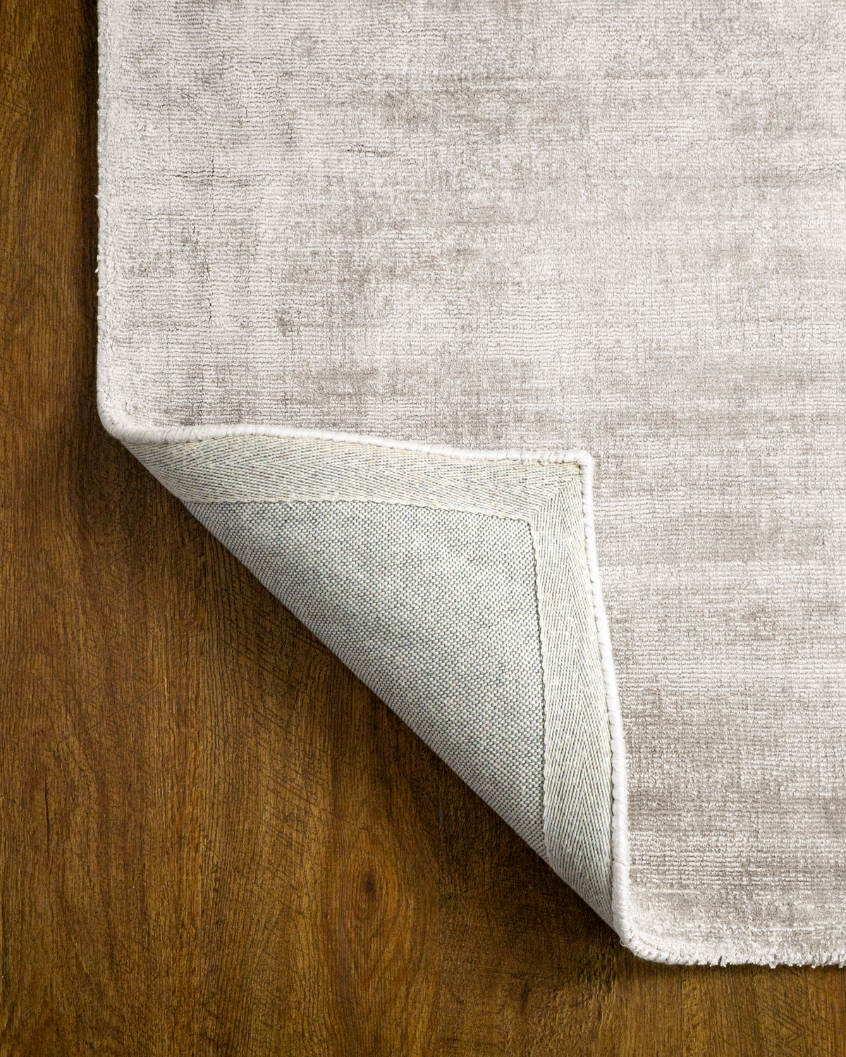 Amara viscose hand-loomed area rug in Pearl, backing view