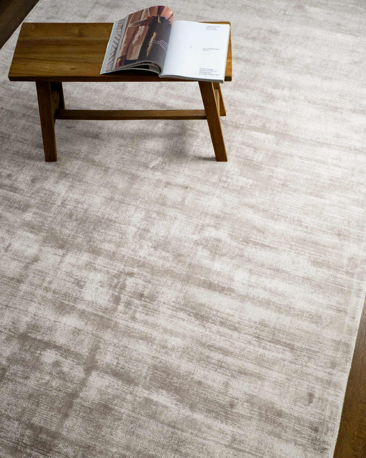 Amara viscose hand-loomed area rug in Pearl, styled in a living room